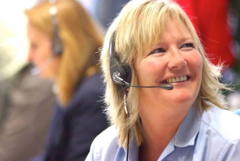 A careline operator smiling