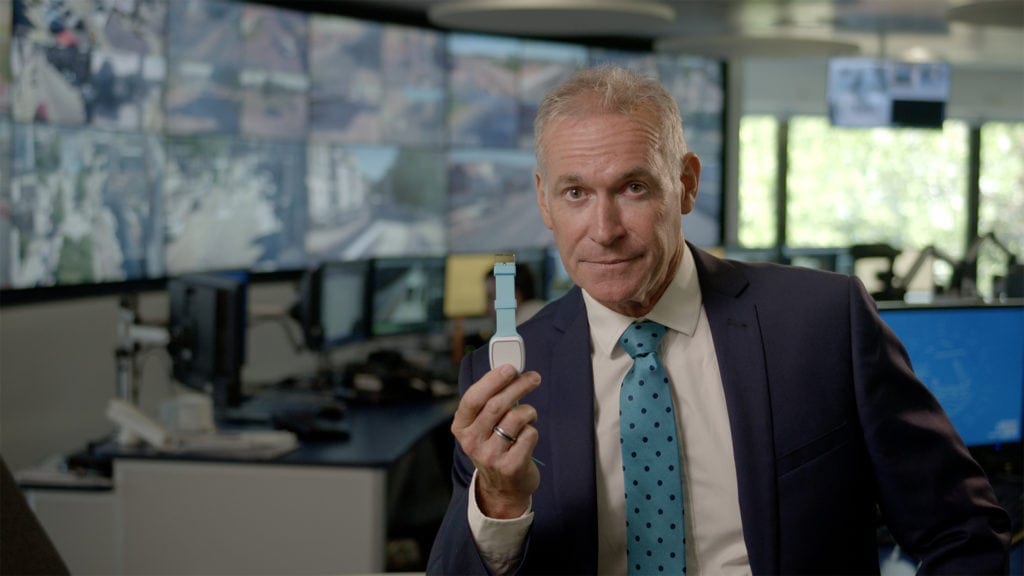 Dr Hilary Jones holding a Telecare24 fall alarm