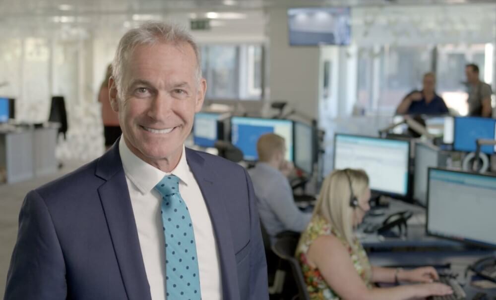 Dr HIlary Jones smiling standing in the Telecare24 office