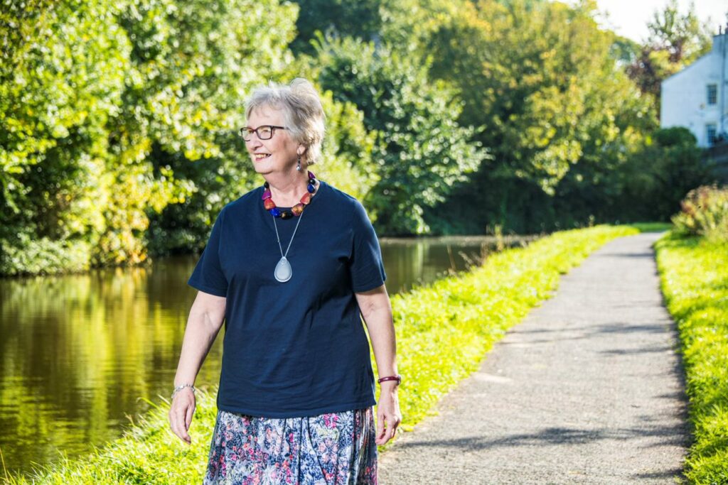 Woman walking outside using the GO! plan