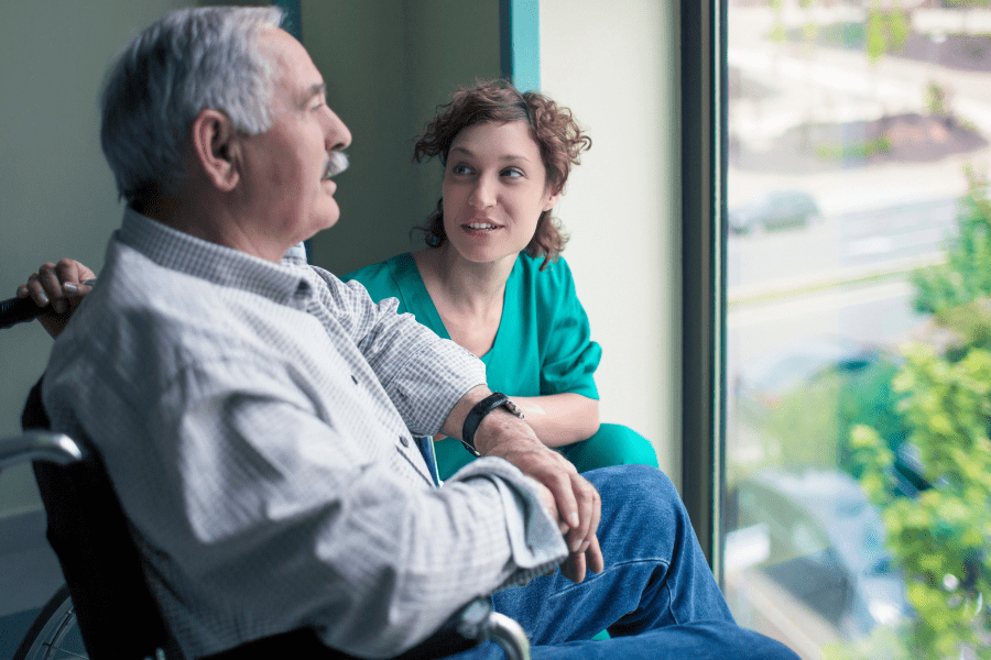 daughter caring elderly father with careline service