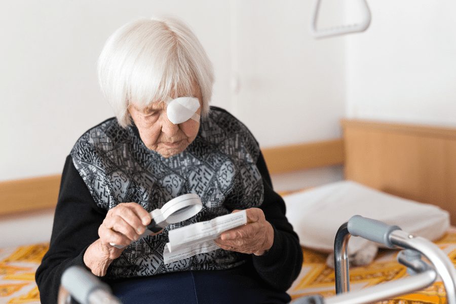 old women using magnifying glass