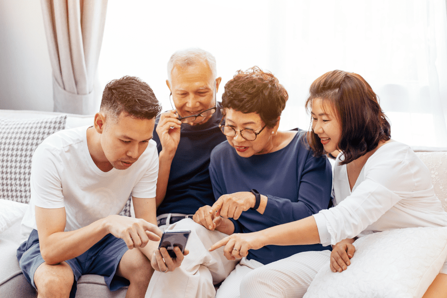 A young couple planning holiday with elderly parents