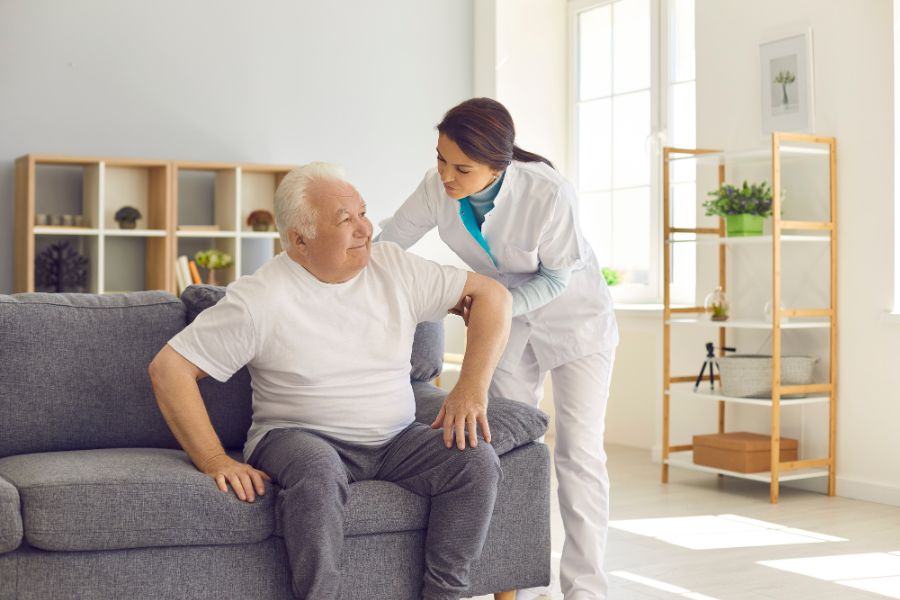 care-giver-assisting-elderly-man