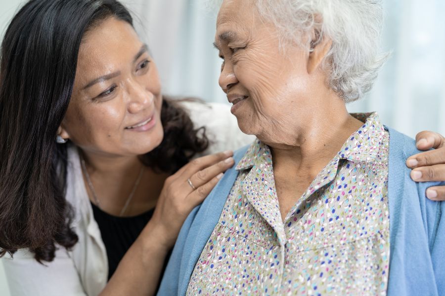 woman-embracing-elderly-mother